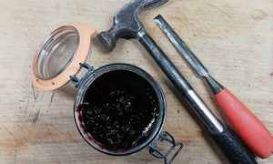 A jar of jam, a hammer and a chisel