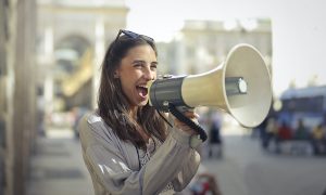 Woman with loud hailer